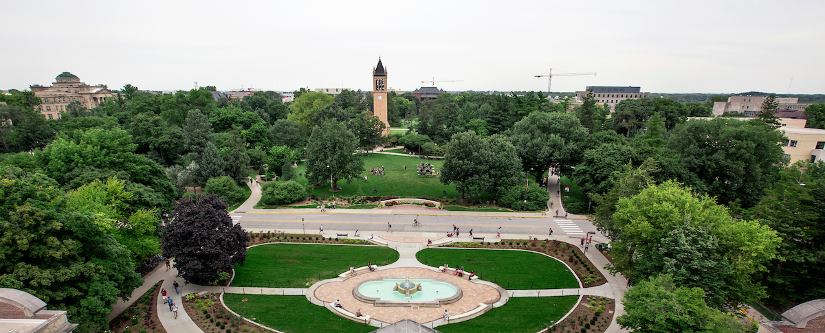Wide angle image of the Iowa State Campanile and campus landscape.
